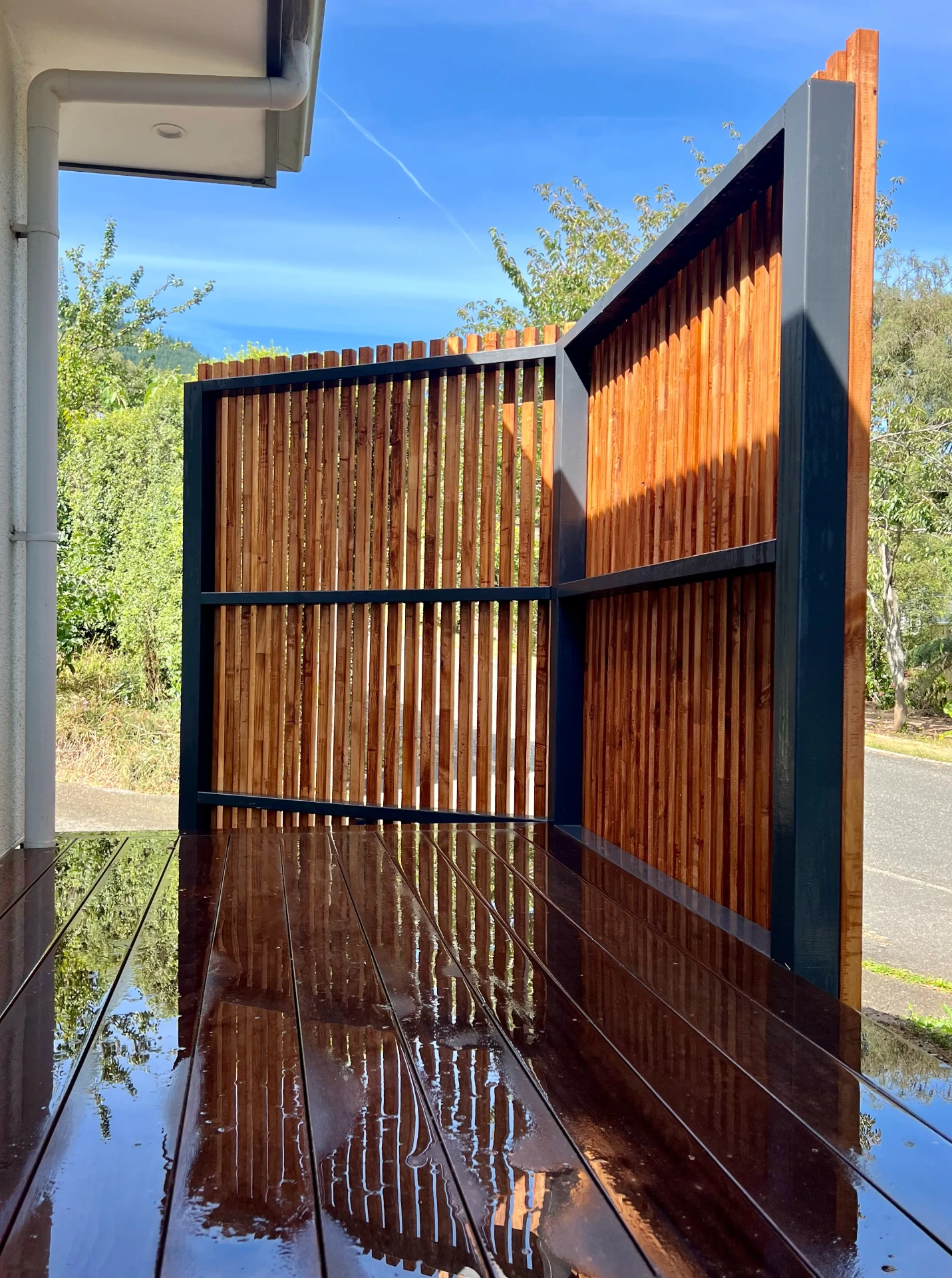 Rear-yard privacy screen with layered planting