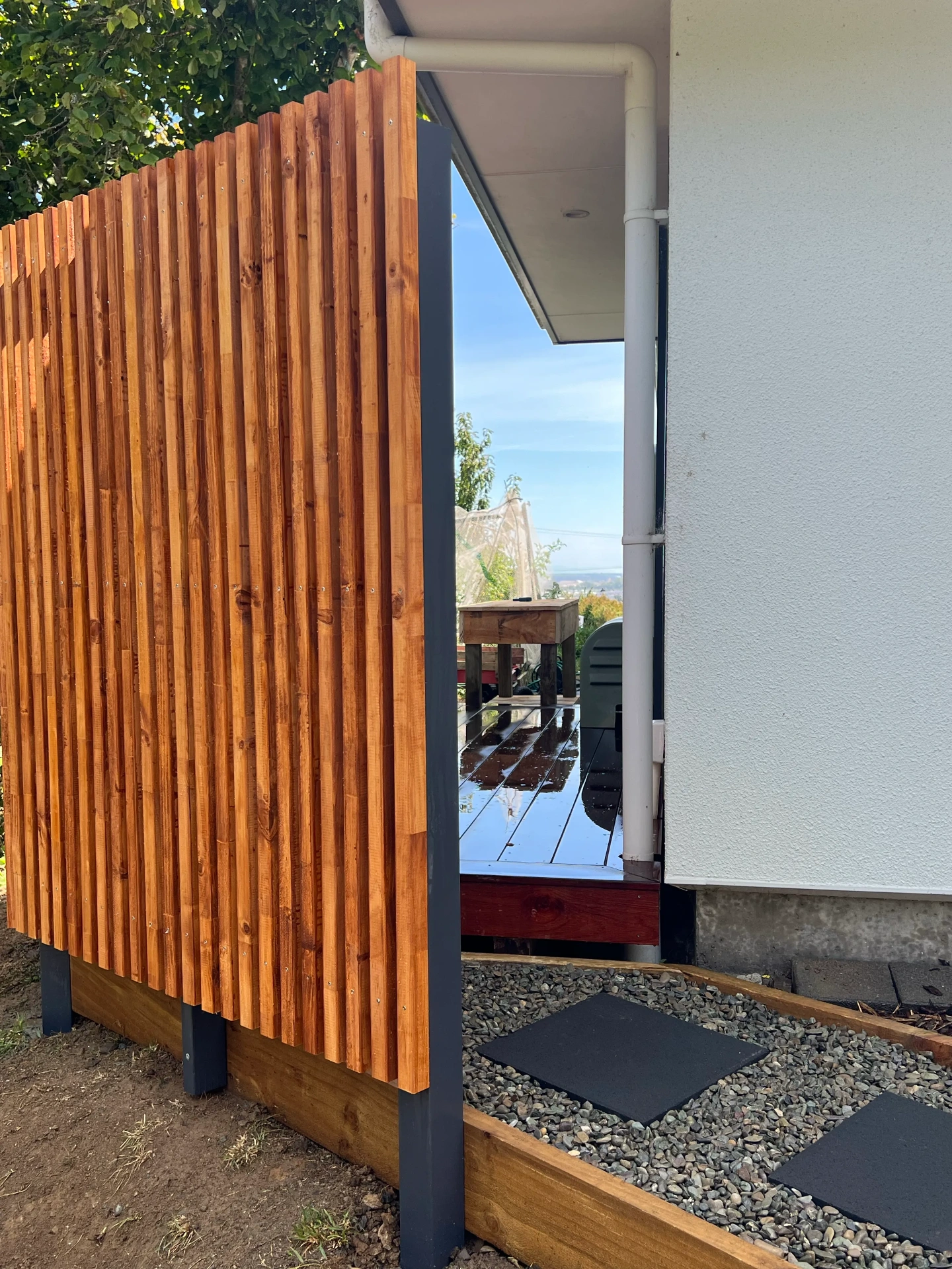 Warm timber privacy screen from the street