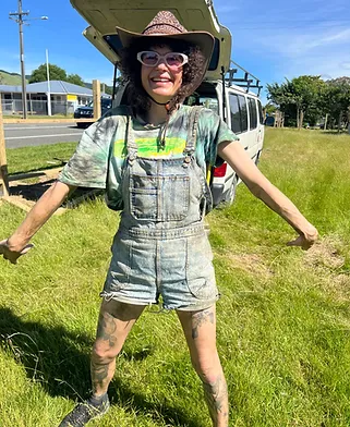 Crew member in denim overalls and sunhat